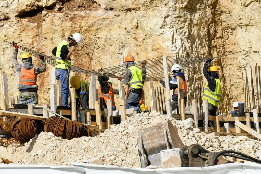 A crew of construction workers on a building site